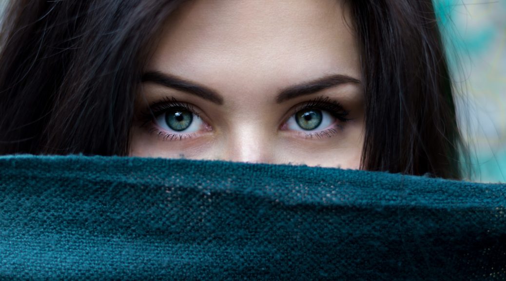 a close up of a person with blue eyes