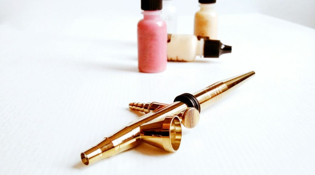 pink nail polish bottle and nail polish